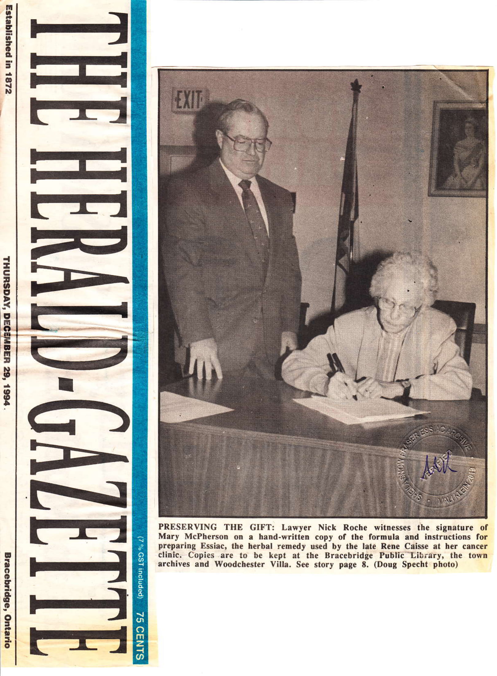 PHOTO FROM THE BRACEBRIDGE ONTARIO HERALD-GAZETTE SHOWING MARY MCPHERSON SIGNING HER ESSIAC TEA FORMULA AND RECIPE AFFIDAVIT BY HER ATTORNEY.