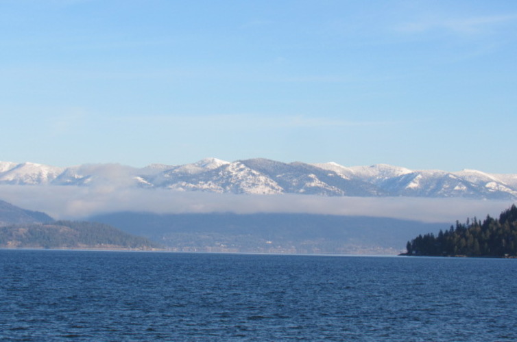 SCENIC LAKE PEND OREILLE IN NORTH IDAHO WITH SNOW-CAPPED MOUNTAINS IN EARLY DECEMBER