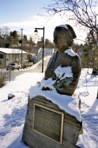 RENE M. CAISSE MEMORIAL UPPER BODY STATUE CARVED FROM STONE WITH RENE WEARING HER NURSE’S UNIFORM